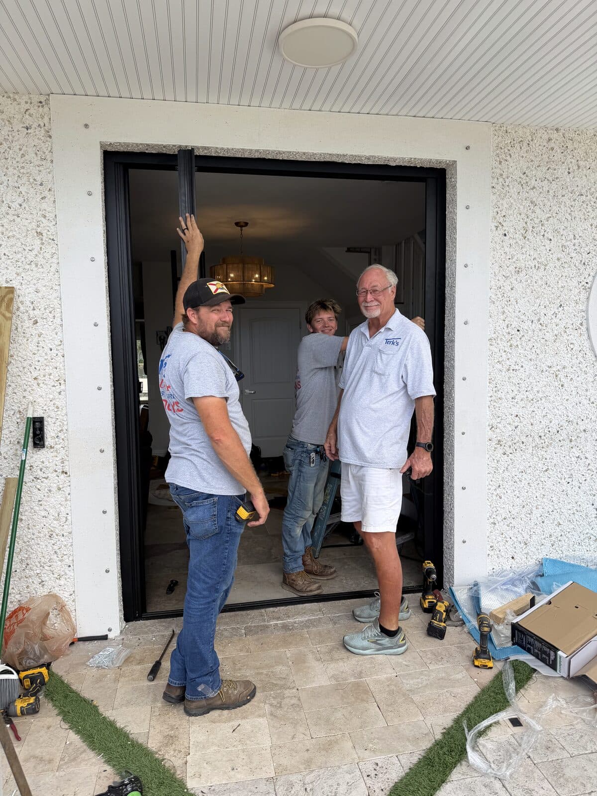 The Terk's Aluminum crew installing a large glass door at a New Port Richey home