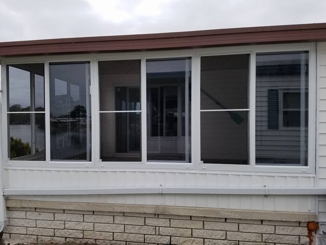Aluminum Florida room and window upgrades on a manufactured home
